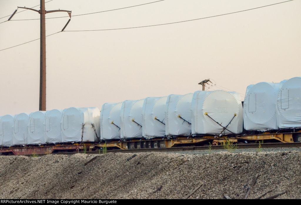 QTTX & KRL Flat cars with load in the yard